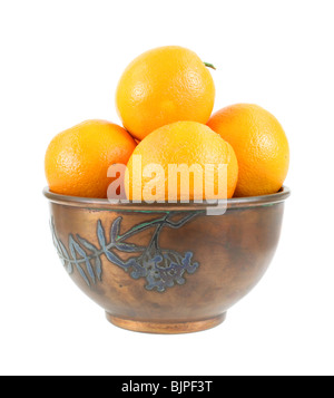 Oranges in vintage metal bowl on white background Stock Photo