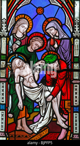 Detail from a stained glass window by Clayton and Bell, depicting The Deposition of Jesus, St Margaret's Church, Witton, Norfolk Stock Photo