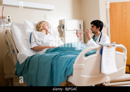 Woman in hospital bed Stock Photo