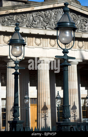 Old lamps and their shadows on the Royal Scotish Academy art gallery in Edinburgh. Stock Photo