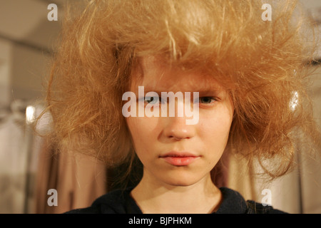 PORTRAIT OF A HIGH FASHION MODEL POSING BEFORE A FASHION SHOW. Stock Photo