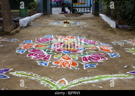 Rangoli festival designs in an Indian street made at the Hindu festival of Sankranthi or Pongal. Stock Photo