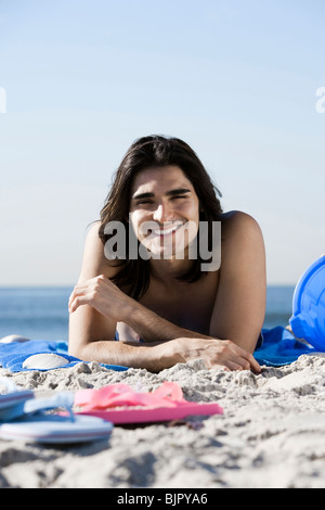 Man lying on the beach Stock Photo