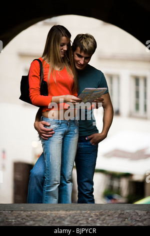 Couple reading a map Stock Photo