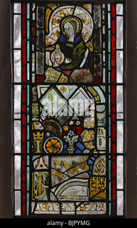 Fragments of Medieval Stained glass re-set into modern window at St Michael and All Angels Church, Barton Turf, Norfolk Stock Photo