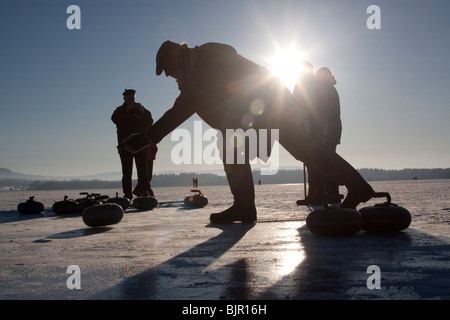 Curling on frozen Lake of Menteith Scotland Stock Photo