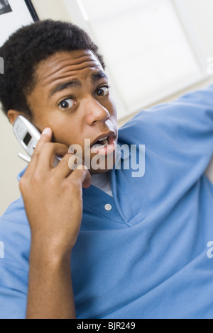 Teenage boy on cellular phone Stock Photo