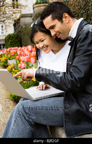 Couple using a laptop Stock Photo
