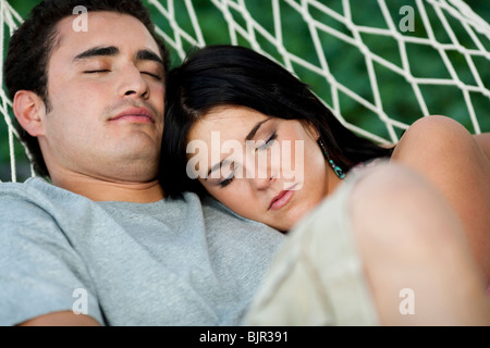 Couple sleeping in a hammock Stock Photo