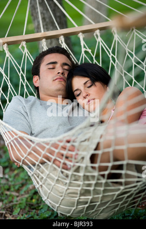Couple sleeping in a hammock Stock Photo
