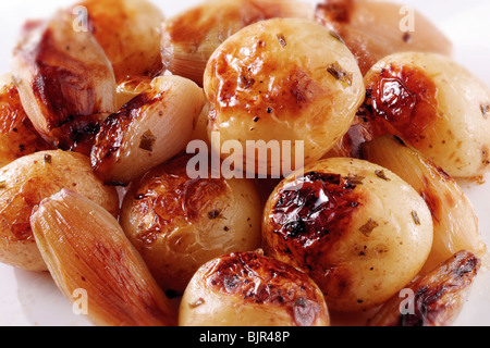 Roast potatoes in their skins and onions food photos Stock Photo