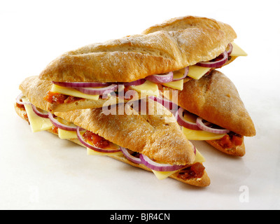 Ploughman's baguette, Cheddar cheese, red onion and pickle. Food photos. Stock Photo