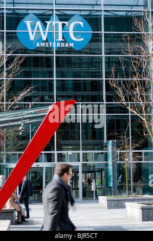 A man walking past the World Trade Center in Amsterdam Zuid, the Netherlands Stock Photo