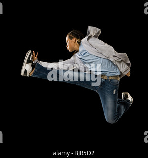 Full-length shot of a young man in sportive attire standing near a climbing  wall and looking aside Stock Photo - Alamy