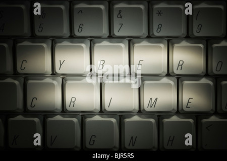 keyboard with cyber crime highlighted Stock Photo