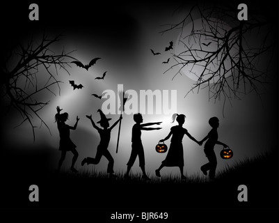 Children playing on Halloween night Stock Photo