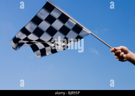 checkered flag being waved Stock Photo