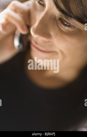 Woman talking on cell phone Stock Photo