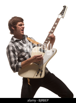 Young man playing guitar, studio shot Stock Photo