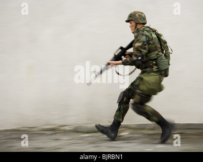 Soldier aiming weapon Stock Photo