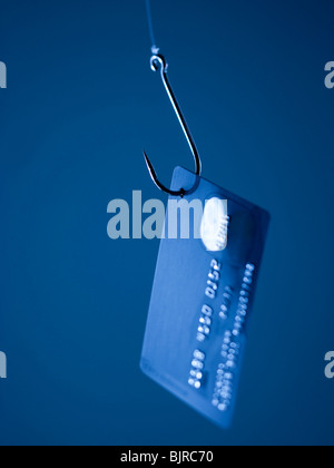 Credit card on fishing hook Stock Photo