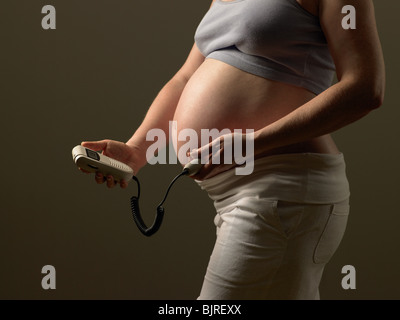 Pregnant woman checking babys pulse Stock Photo