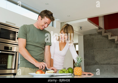 Couple preparing fruit Stock Photo