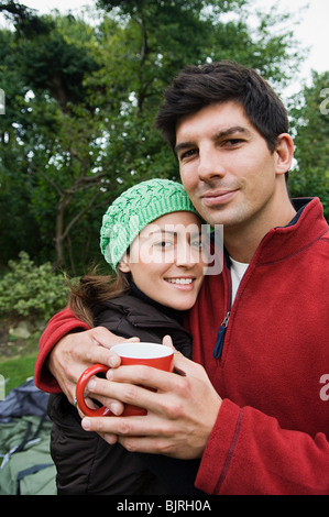 Couple keeping warm Stock Photo