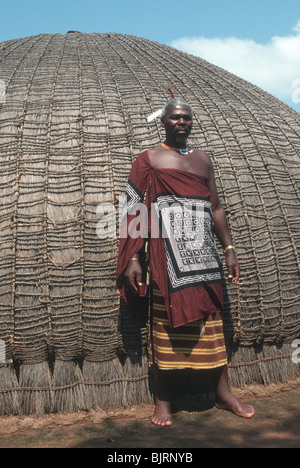 SWAZILAND. SWAZI MEDICINE MAN OUTSIDE HIS VILLAGE HUT Stock Photo