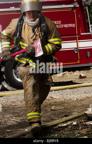 Firefighter Hero In Action Danger Jumping Over Fire Flame To Rescue And ...