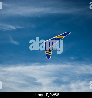 USA, Utah, Lehi, young man hang gliding, low angle view Stock Photo