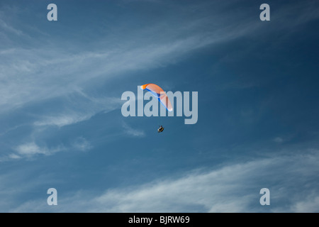 USA, Utah, Lehi, young man paragliding, low angle view Stock Photo