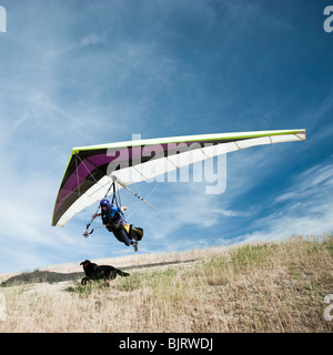 USA, Utah, Lehi, man taking off in hang-glider Stock Photo