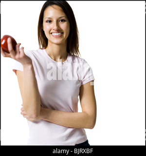 Woman holding a red apple Stock Photo