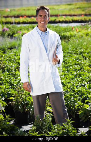 USA, Utah, Salem, portrait of scientist with clipboard in field Stock Photo
