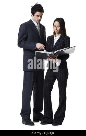 Businessman and businesswoman reviewing documents Stock Photo
