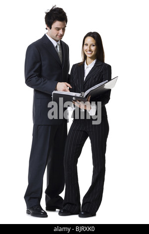 Businessman and businesswoman reviewing documents Stock Photo