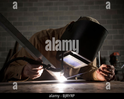 USA, Utah, Orem, welder using torch Stock Photo