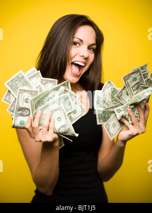 Happy woman holding US dollar bills Stock Photo