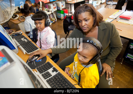 Detroit, Michigan - First grade teacher Ivy Bailey teaches computers at MacDowell Elementary School. Stock Photo