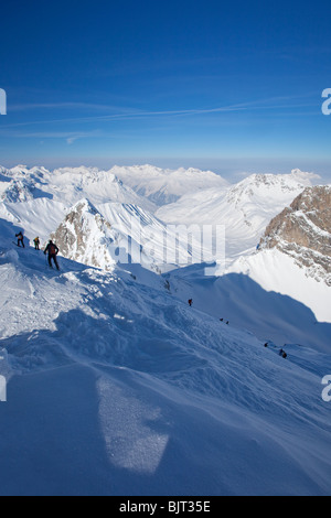 Skiing off-piste from summit of Valluga in St Saint Anton am Arlberg in ...