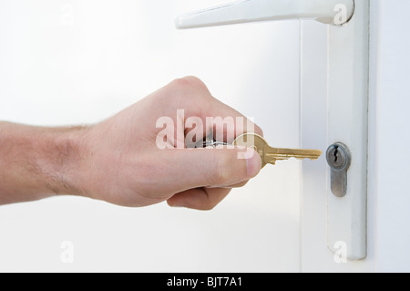 Door and person with key Stock Photo
