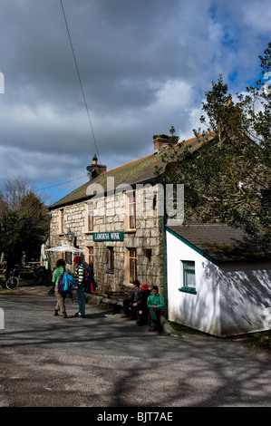 Holidaymakers waiting outside the Lamorna Wink public house in Cornwall. Stock Photo