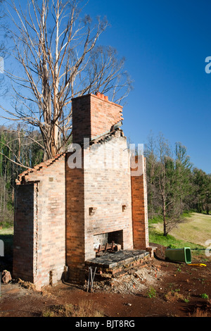 Bush fire damage in Kinglake, Victoria, Australia. The chimney stack is all that is left of this house. Stock Photo