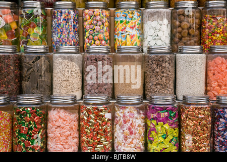 Sweets in crystal jugs. Bikaner street shop. Rajasthan. India Stock Photo