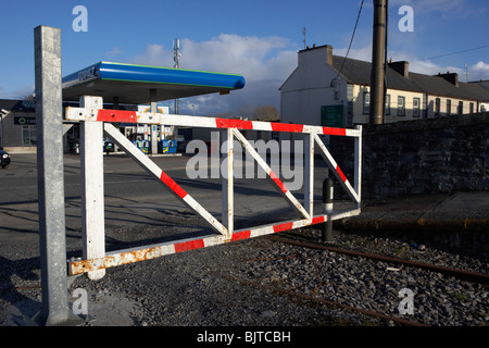 old railway stop gate with new metal post on old disused Charlestown railway station county mayo republic of ireland Stock Photo