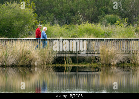 Couple walking at Bailey Tract Preserve - Sanibel Island, Florida USA Stock Photo