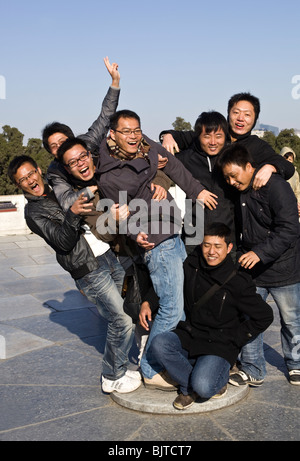 Young Chinese Men standing on Circular Mound Altar Imperial Vault of Heaven Beijing China Stock Photo