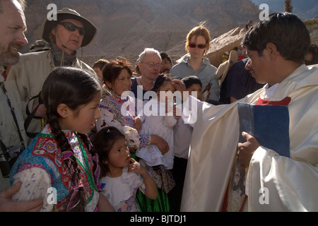 Children baptized in ceremony on the bottom of Colca Canyon Valley, the deepest canyon on Earth. Peru, South America Stock Photo