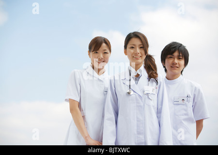 Doctor and nurses looking at the camera Stock Photo